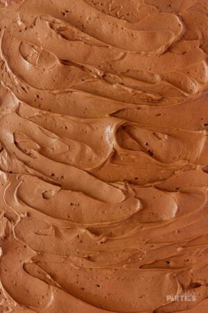 Chocolate frosting spread on a sheet cake.