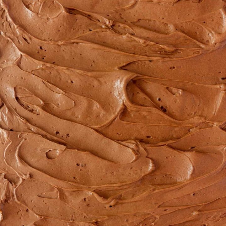 Chocolate frosting spread on a sheet cake.