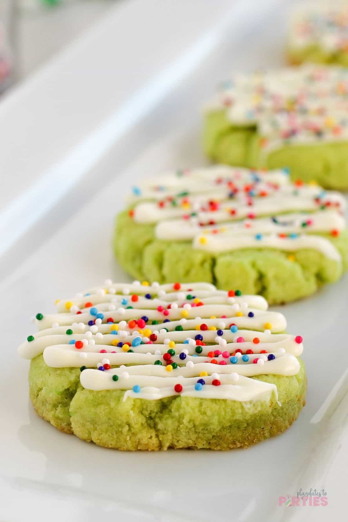Lime cookies on a white plate.