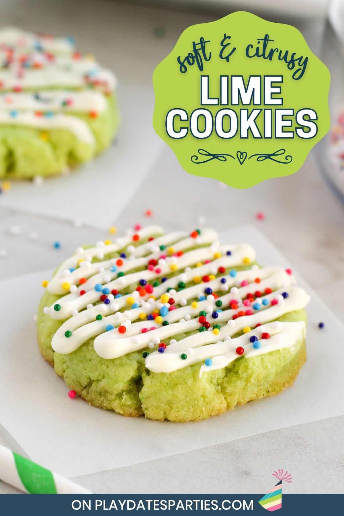 Two lime cookies on a marble surface decorated with a drizzle and colorful sprinkles.