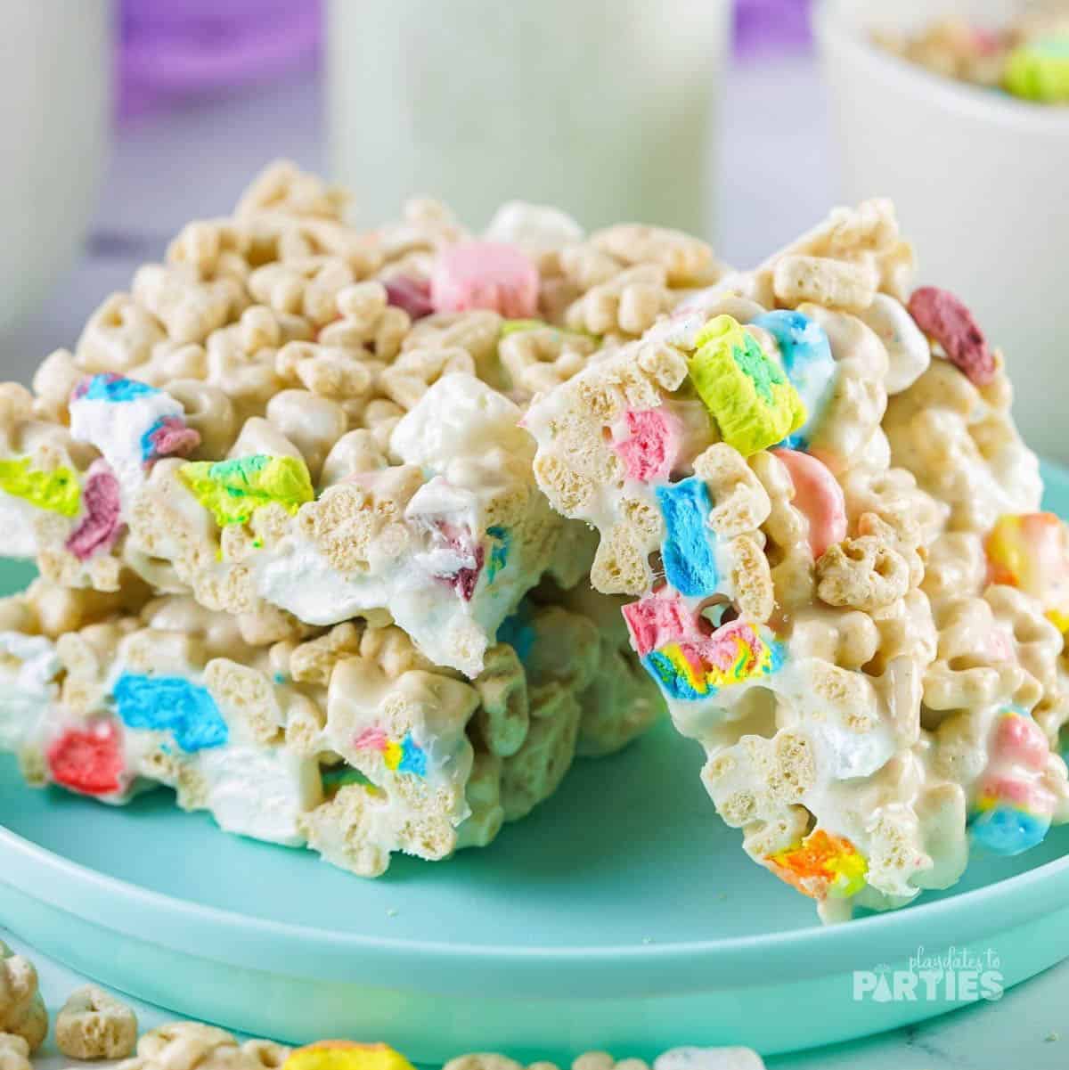 St Patrick's Day cereal treats on an aqua plate.