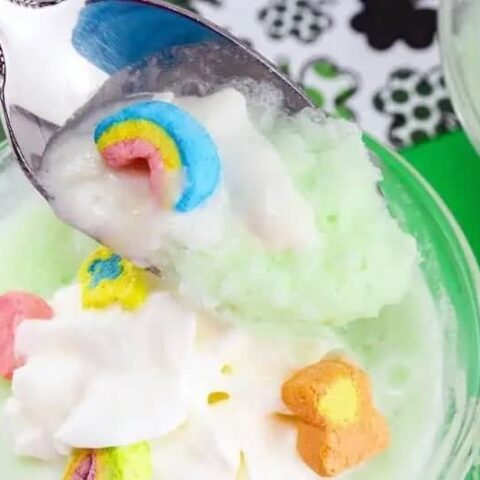 Green St. Patrick's Day frozen hot chocolate garnished with whipped cream and Lucky Charms marshmallows.