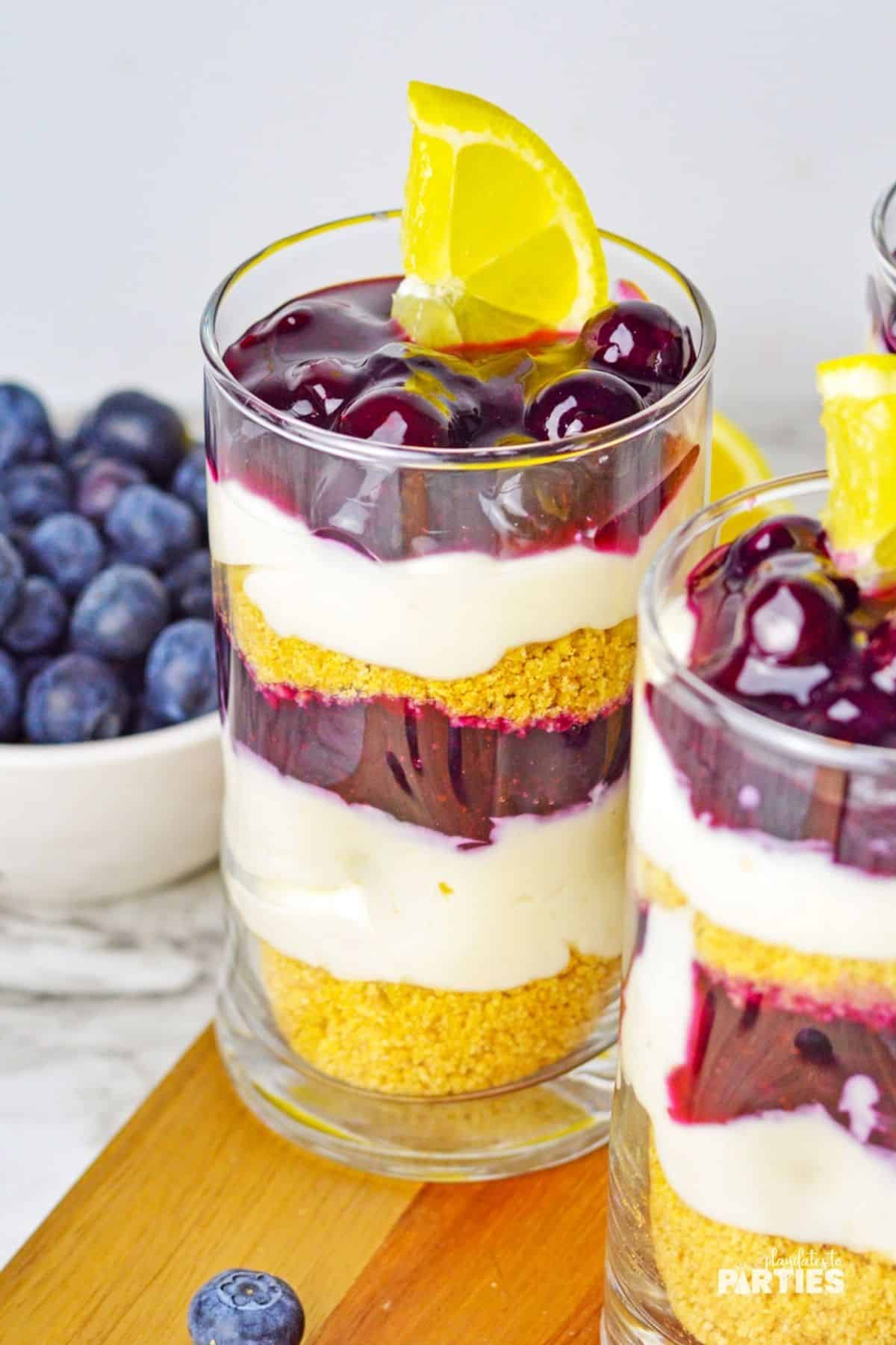 A single serve parfait with blueberry compote and yogurt.