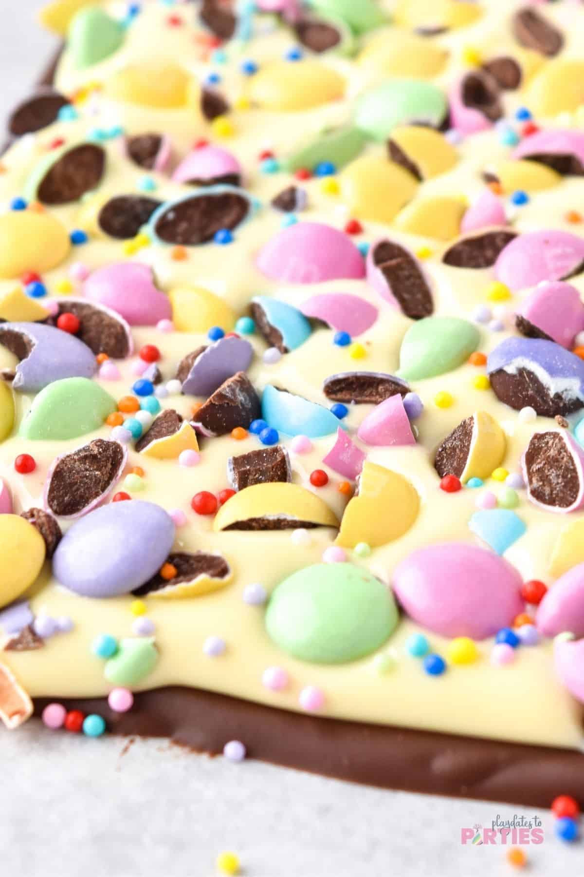Close up of Easter Chocolate bark with candy and sprinkles.