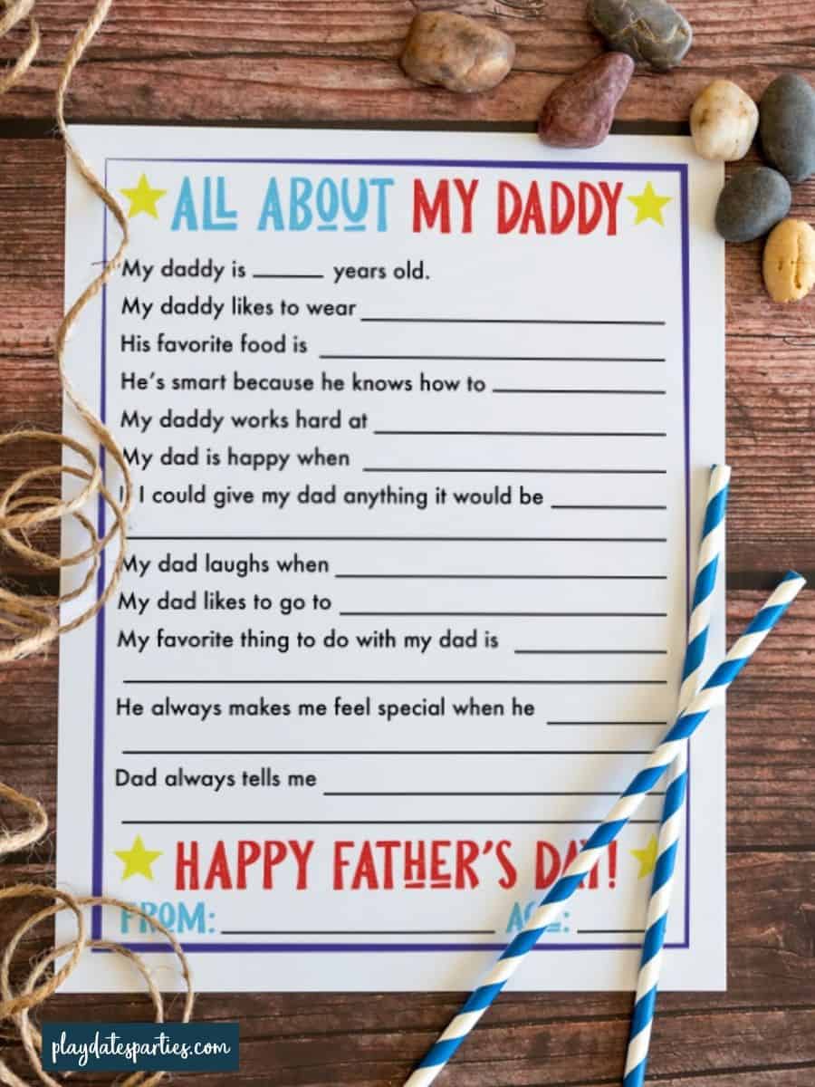 Free printable Father's Day interview sheet on a wood surface.