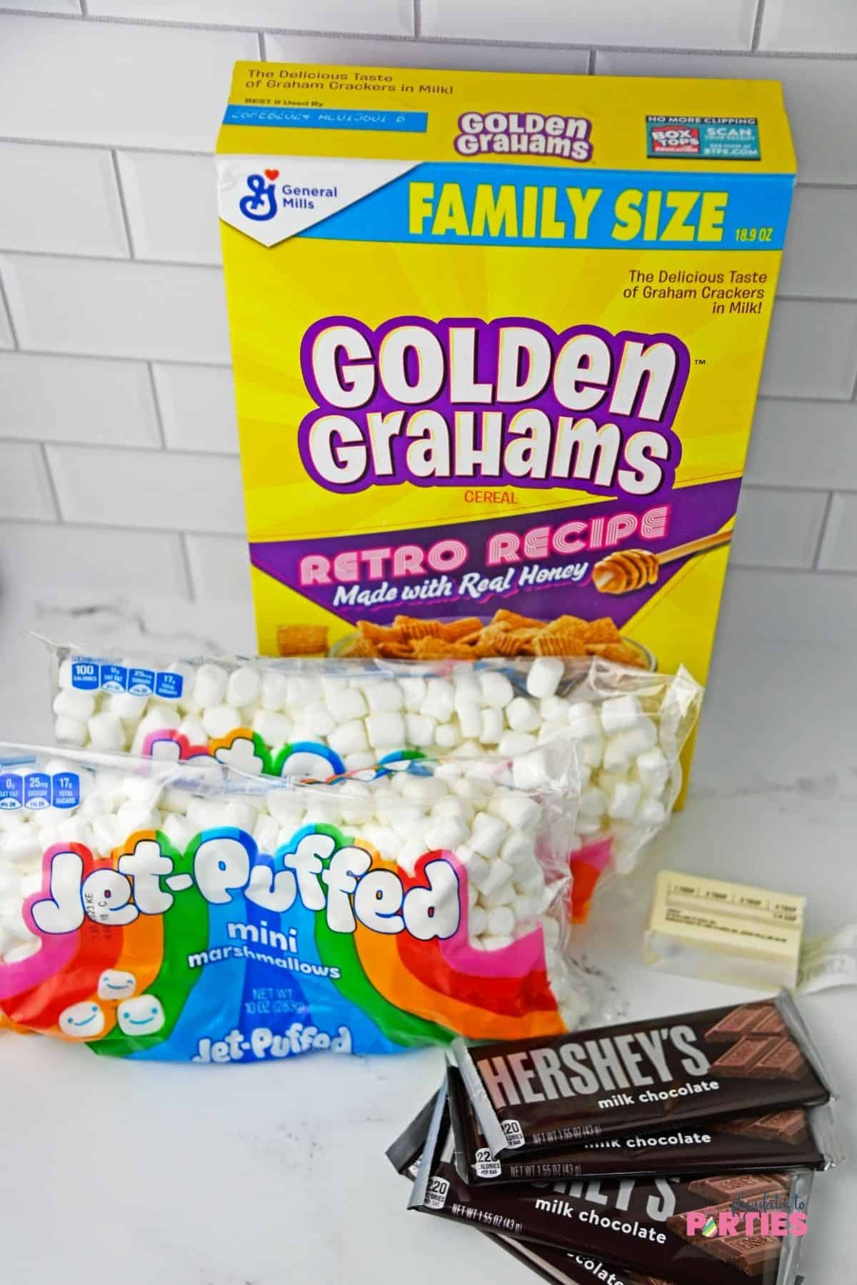Ingredients include Golden Grahams, marshmallows, butter, and chocolate bars.
