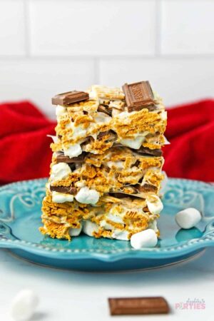 S'mores cereal bars stacked on a blue plate.