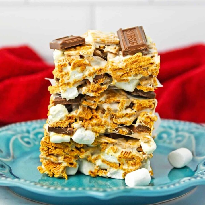 S'mores cereal bars stacked on a blue plate.