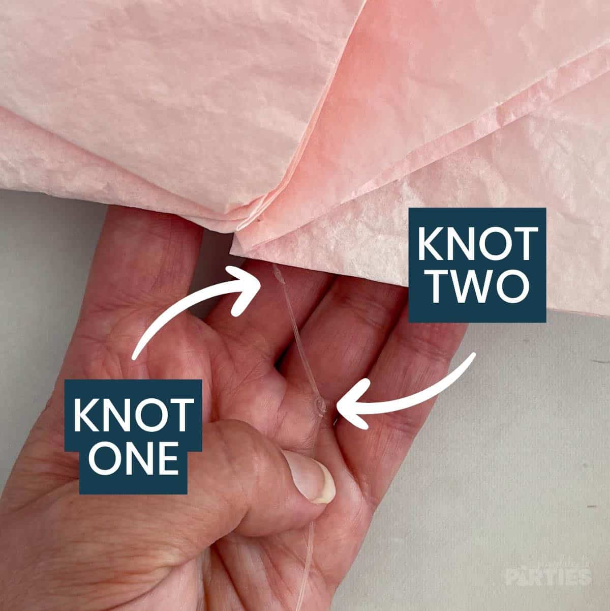 Knots one and two are pointed out after 4 coffee filters are threaded onto monofilament.