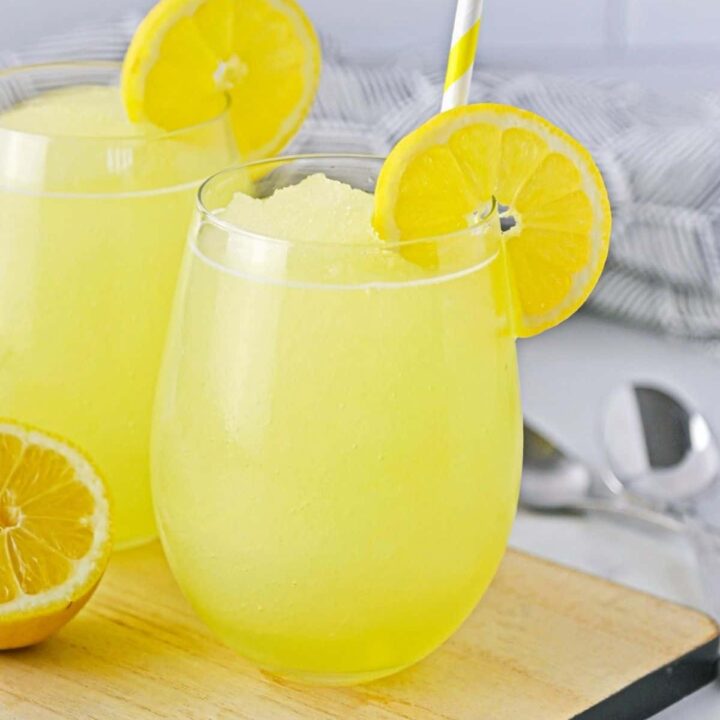 Two glasses filled with lemonade slushy.