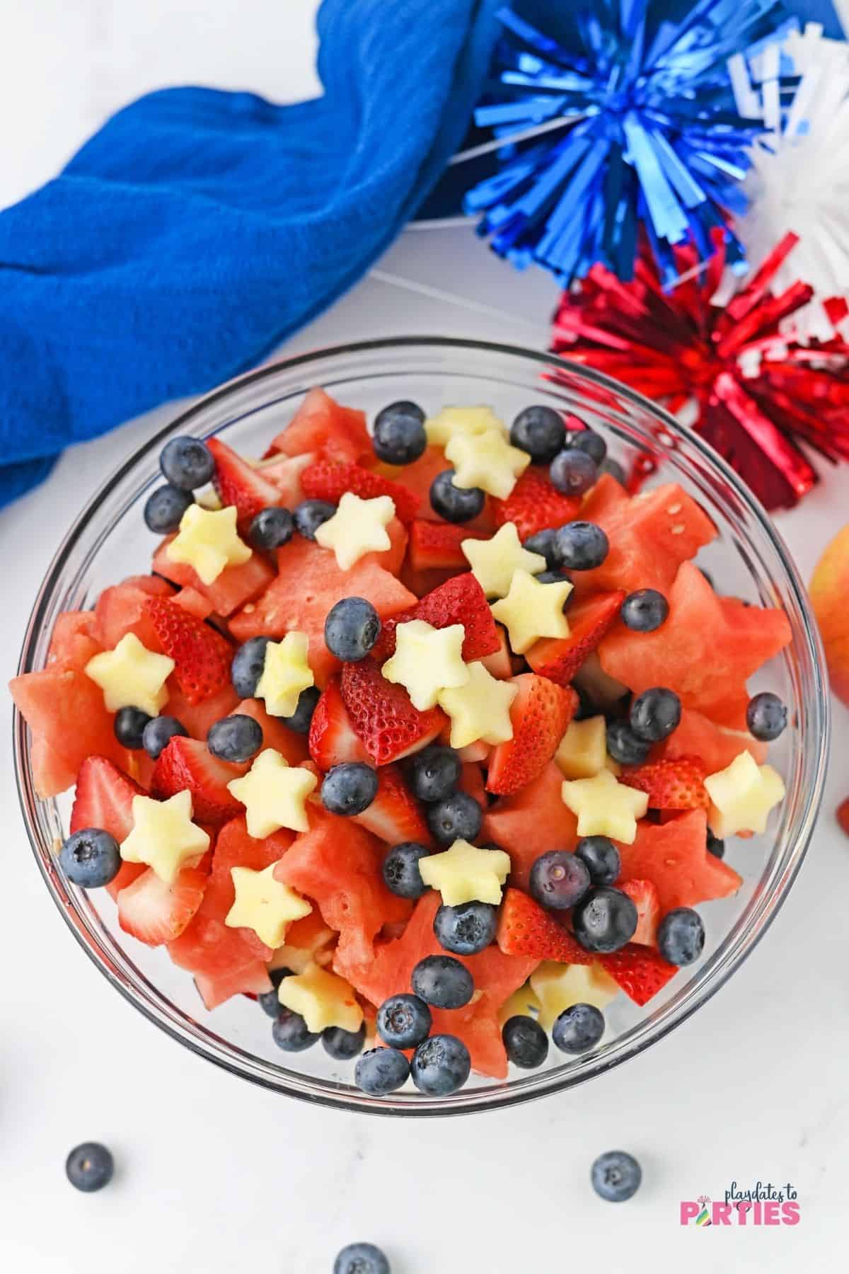 Star spangled fruit salad in a large serving bowl.