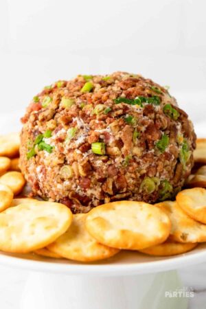 Finished cheese ball covered in bacon and pecans.
