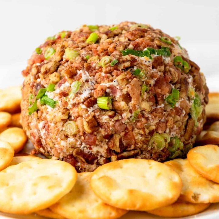 Finished cheese ball covered in bacon and pecans.