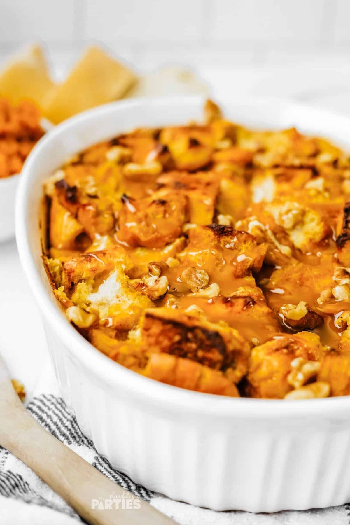 Nuts and glistening sauce transform Thanksgiving bread pudding into a delicious dessert.