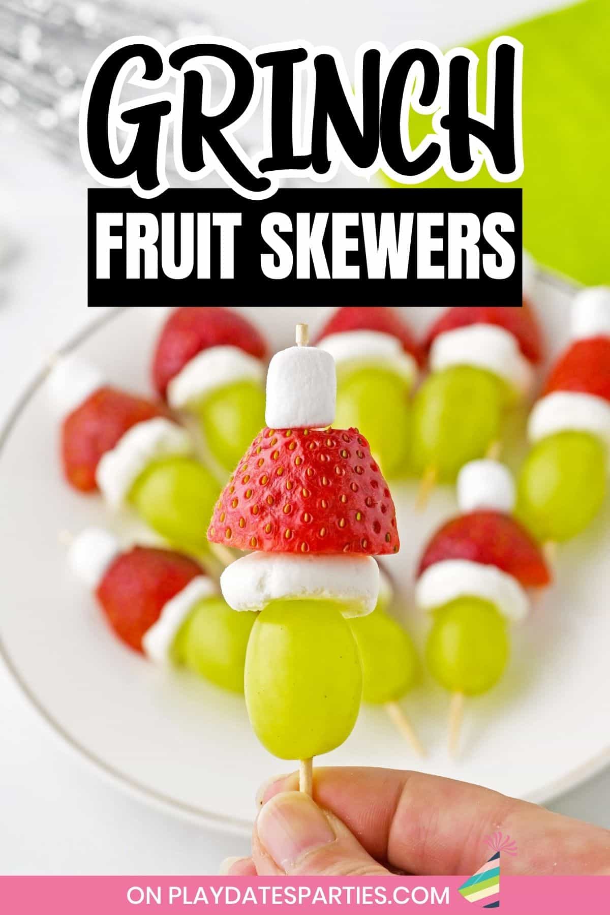 Grinch fruit skewers pin image.