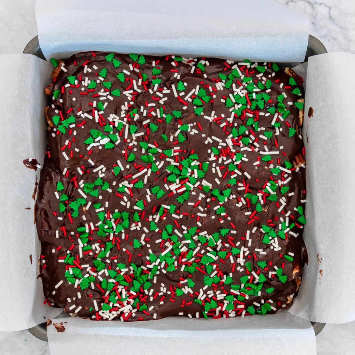 A pan of choco mallow decorated with Christmas sprinkles.