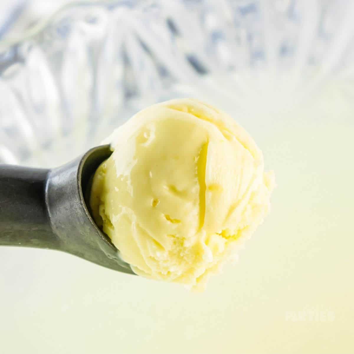 A scoop of yellow sherbet.