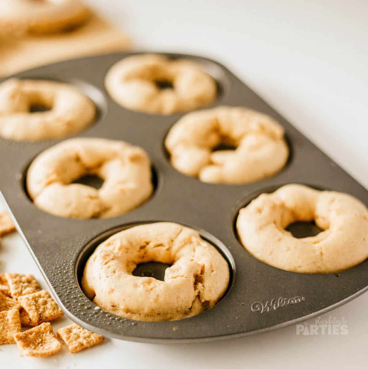 Homemade donuts in a pan after baking.