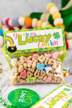 Saint Patricks Day goodie bag filled with lucky charms cereal with a printable topper.