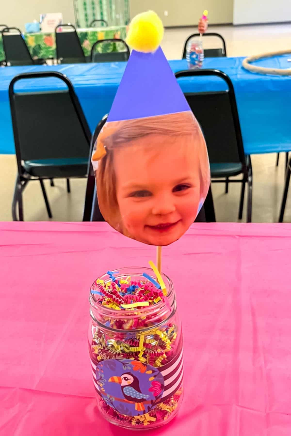 Birthday party centerpieces with the birthday kids face.