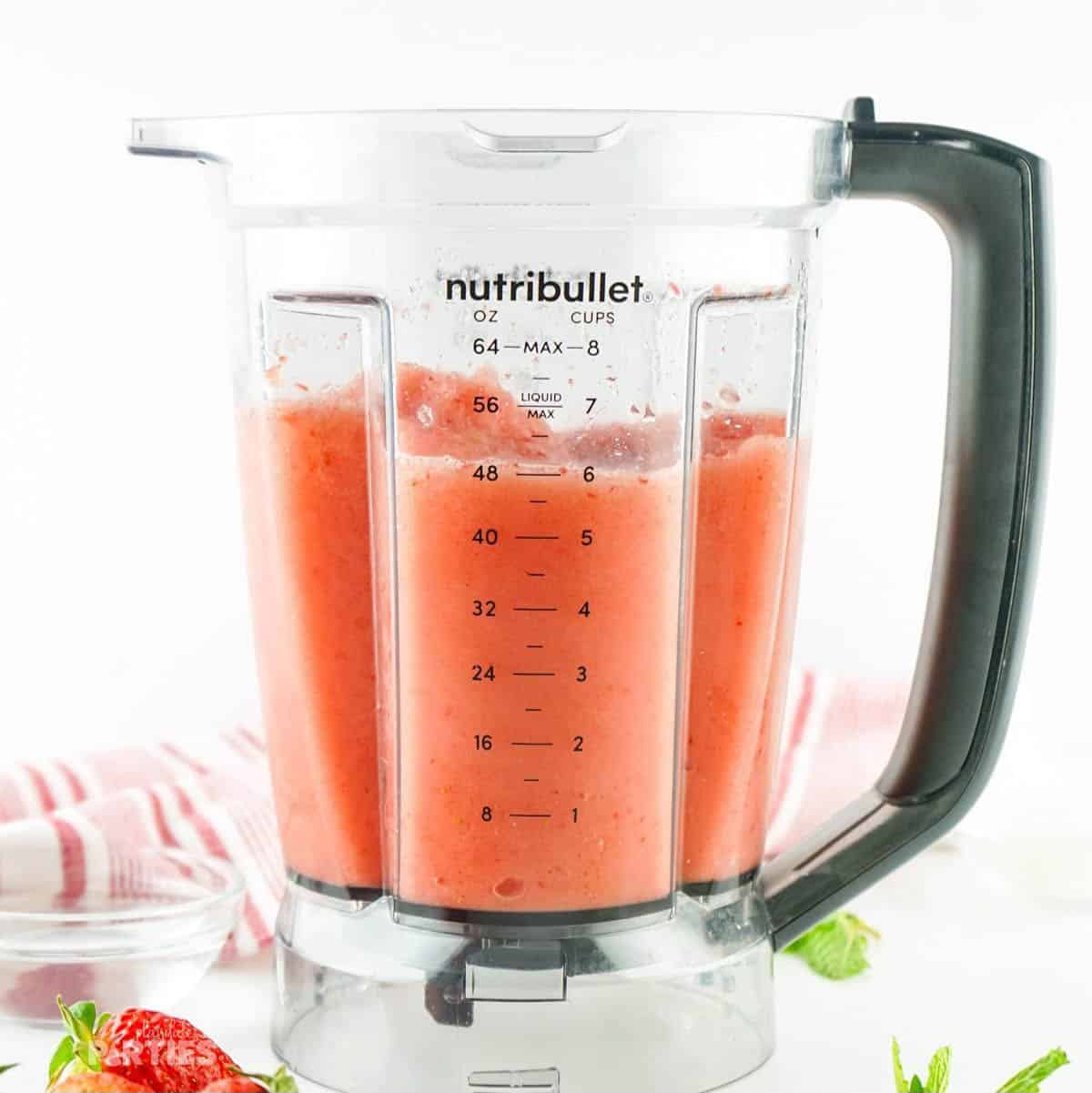 About 6 cups of strawberry slushy in a large blender cup.