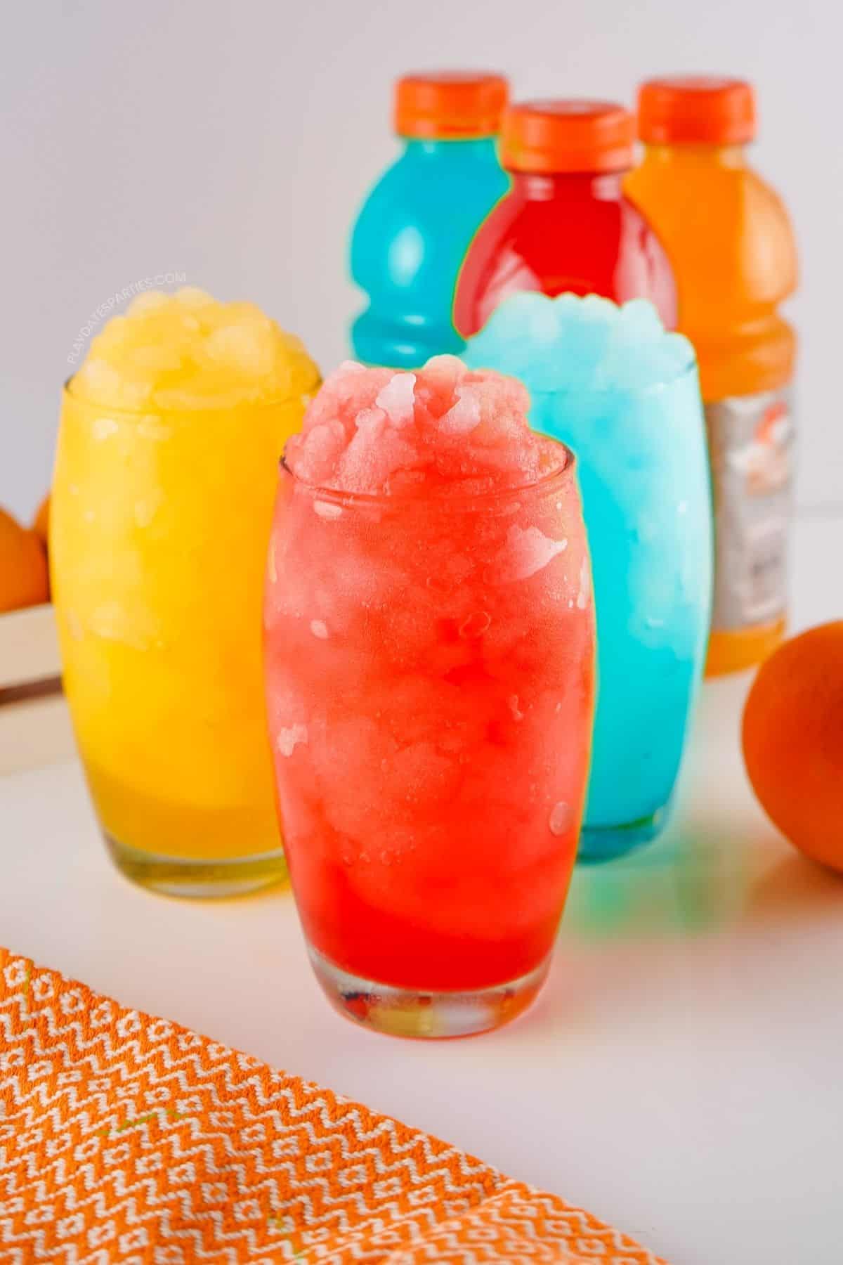 Three Gatorade Slushies in blue, red, and orange.