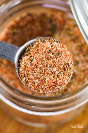 Measuring homemade steak seasoning.