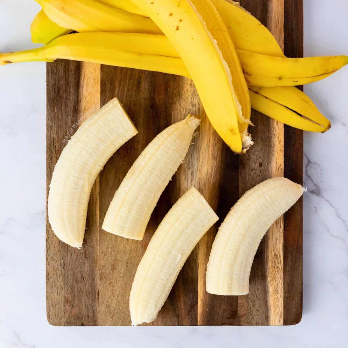 Sliced bananas on a cutting board.