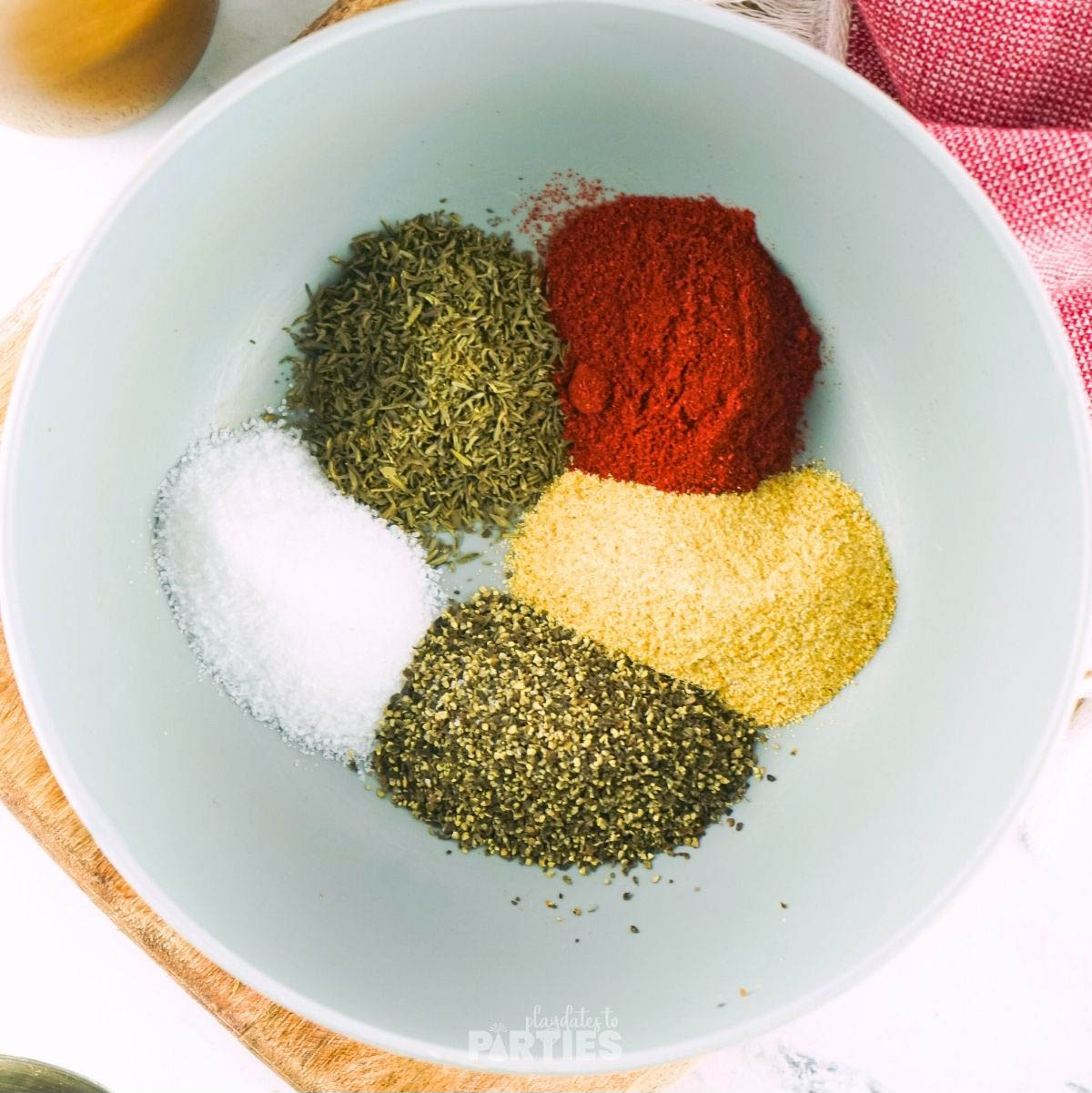 Steak seasoning ingredients measured into a bowl.