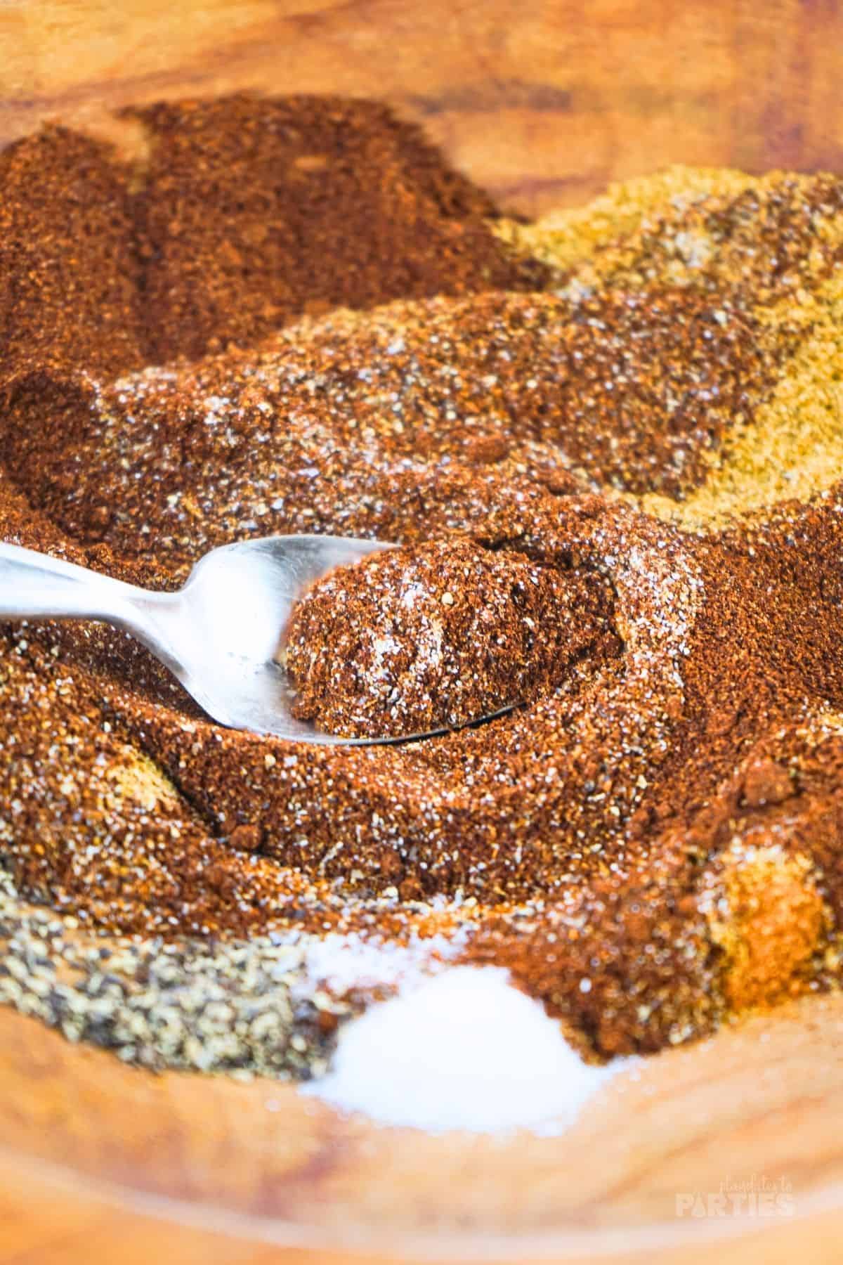 Stirring homemade Chili seasoning.