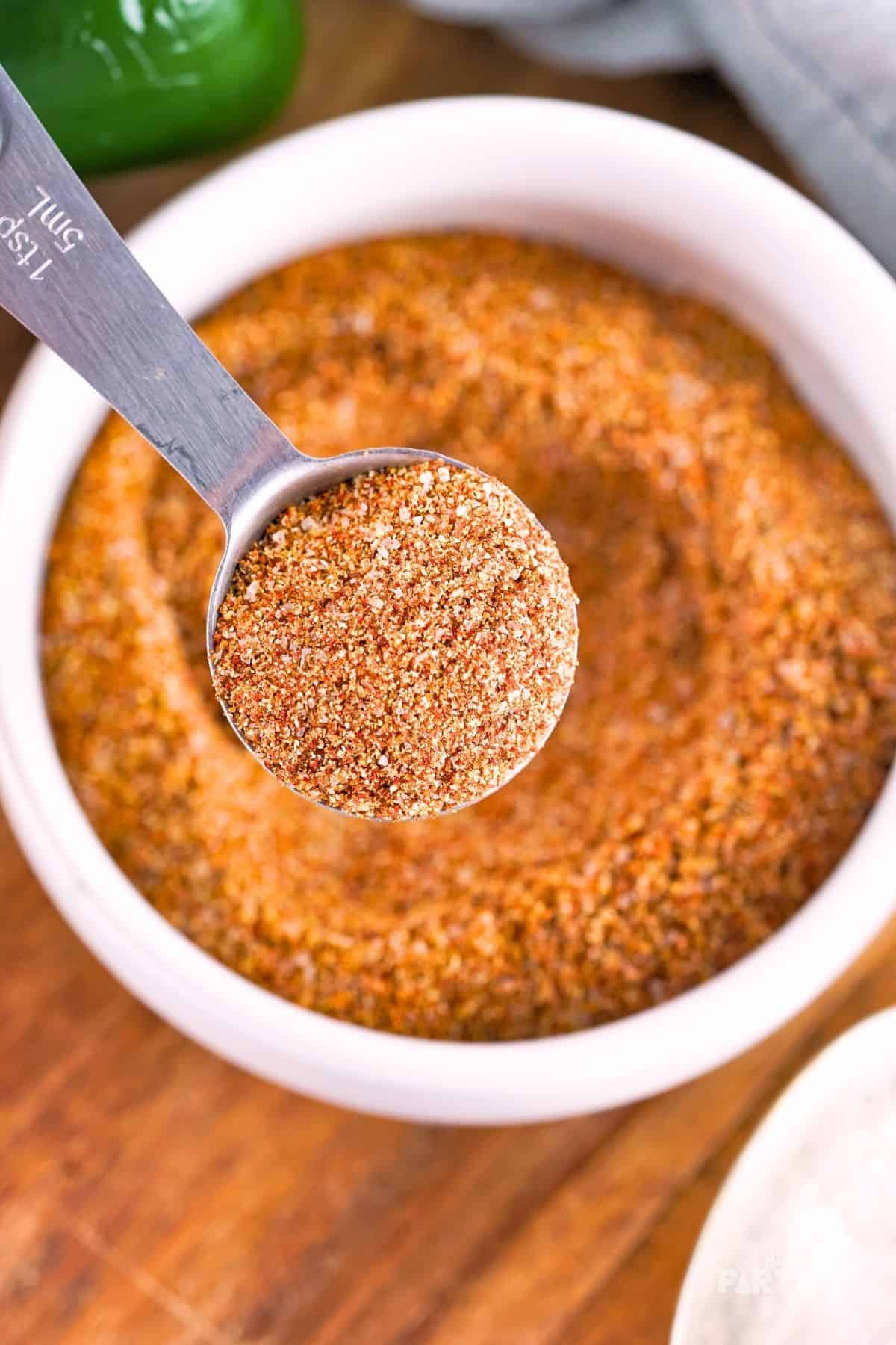 A Tablespoon filled with Fajita Seasoning Mix.