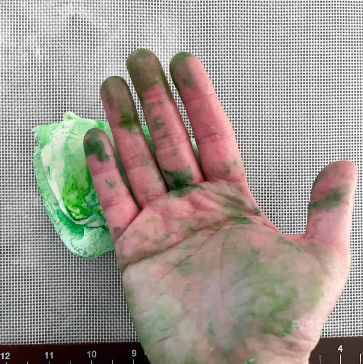 Green hands from coloring fondant.