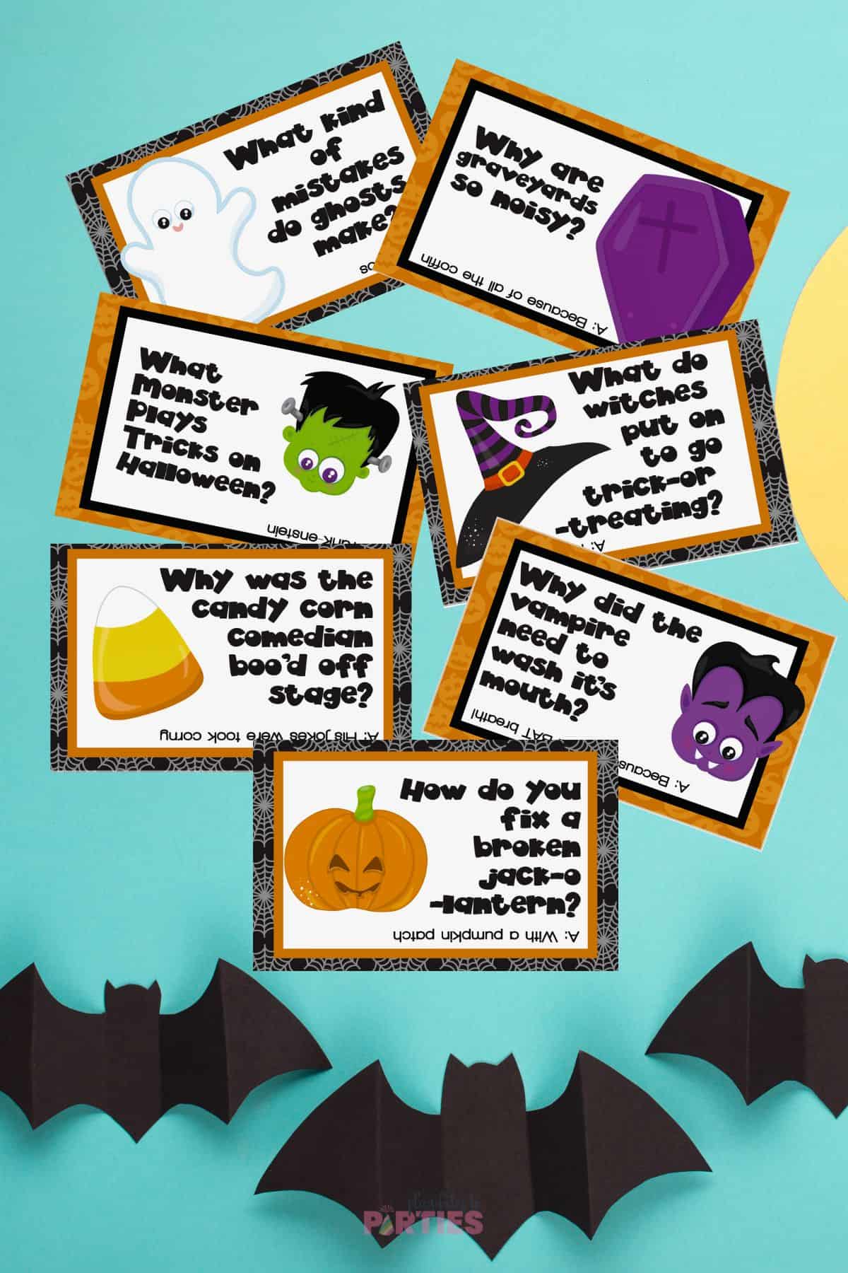 Halloween joke cards with paper bats below.