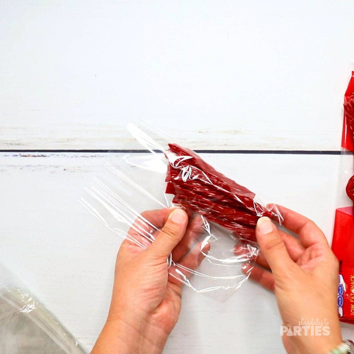 Step 4 - Placing the Twizzlers in the bag.