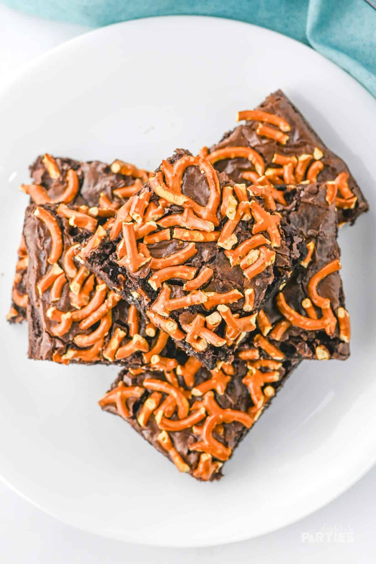 Overhead view of Beer Brownies with Pretzels on a white plate.