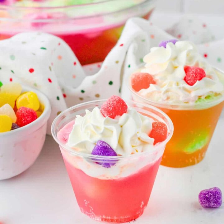Gumdrop Punch cups in front of a punch bowl.