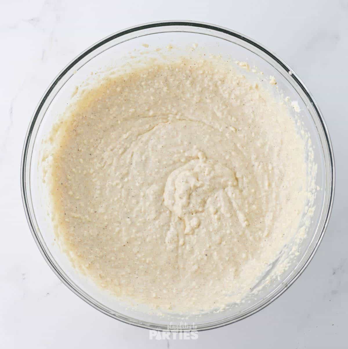 Whisked egg beaten with eggnog, cream cheese, and spices.