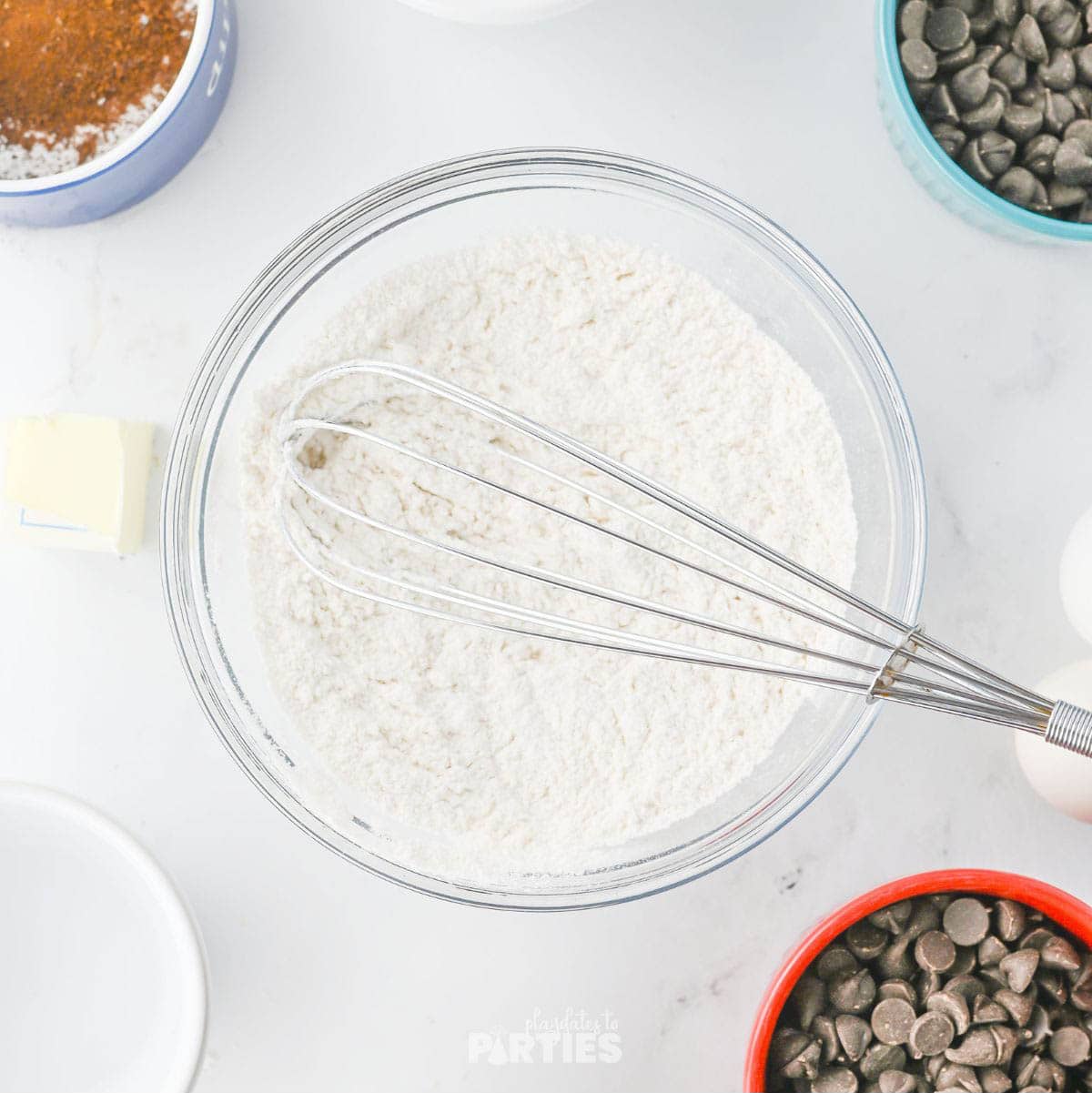 Whisking dry ingredients together.