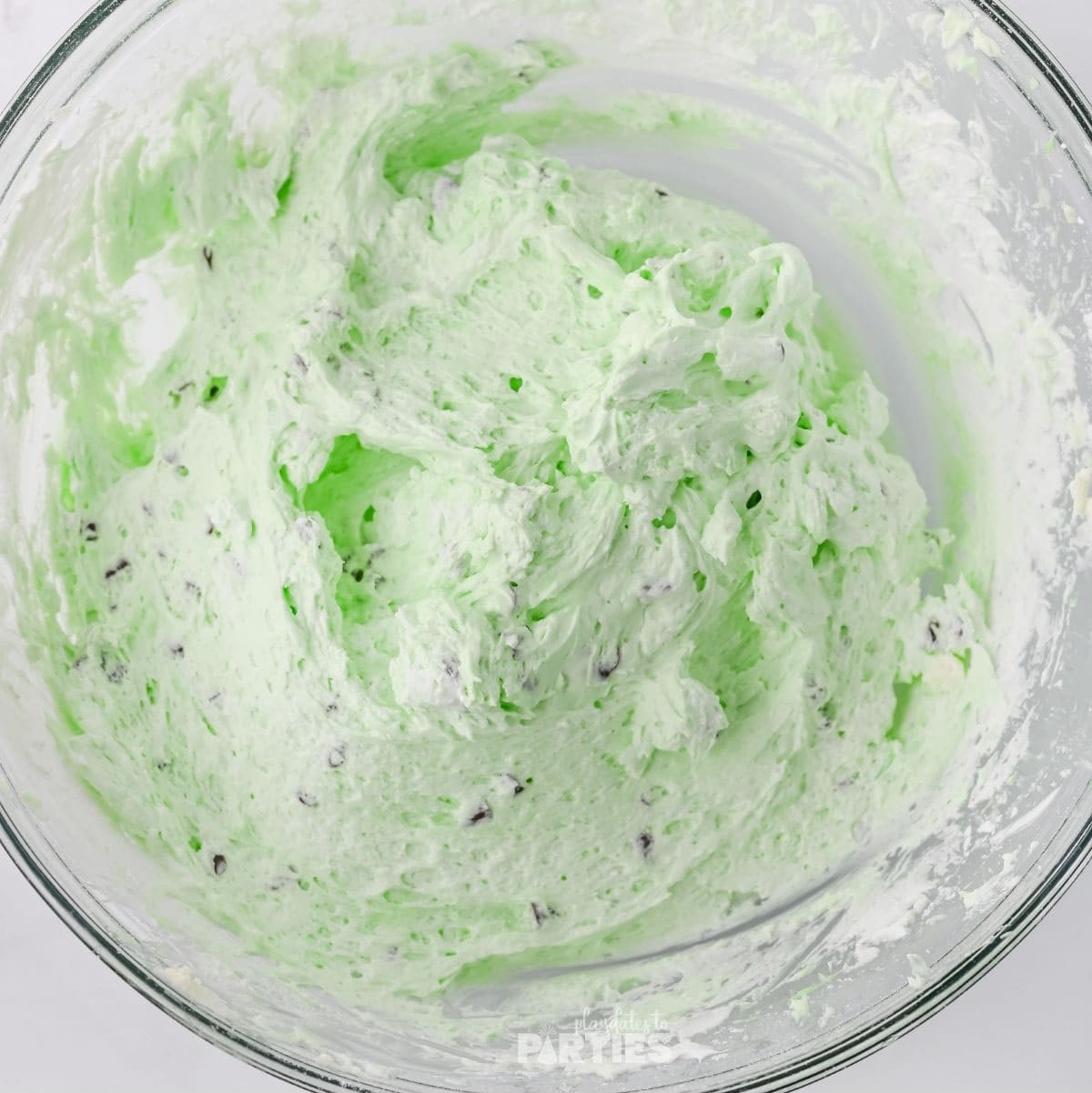 Adding whipped cream creates fluffy green mint chip dip.