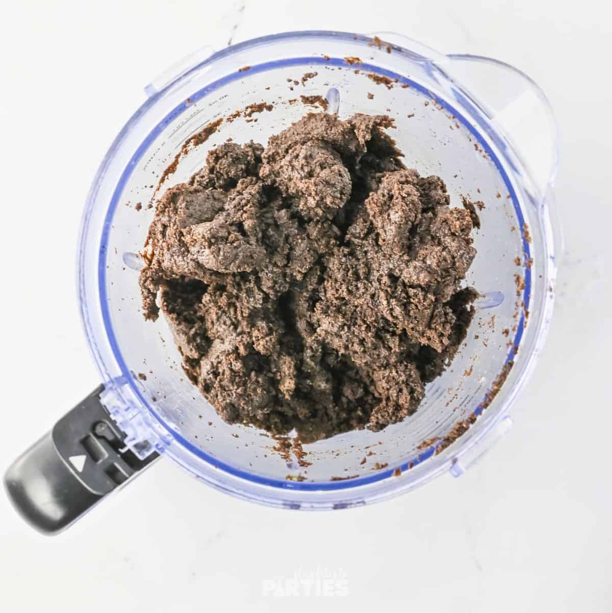 Crushed Oreo cookies mixed with butter.