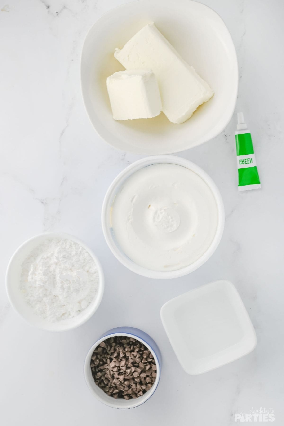 Ingredients include cream cheese, powdered sugar, mint extract, food coloring, cool whip, and mini chocolate chips.