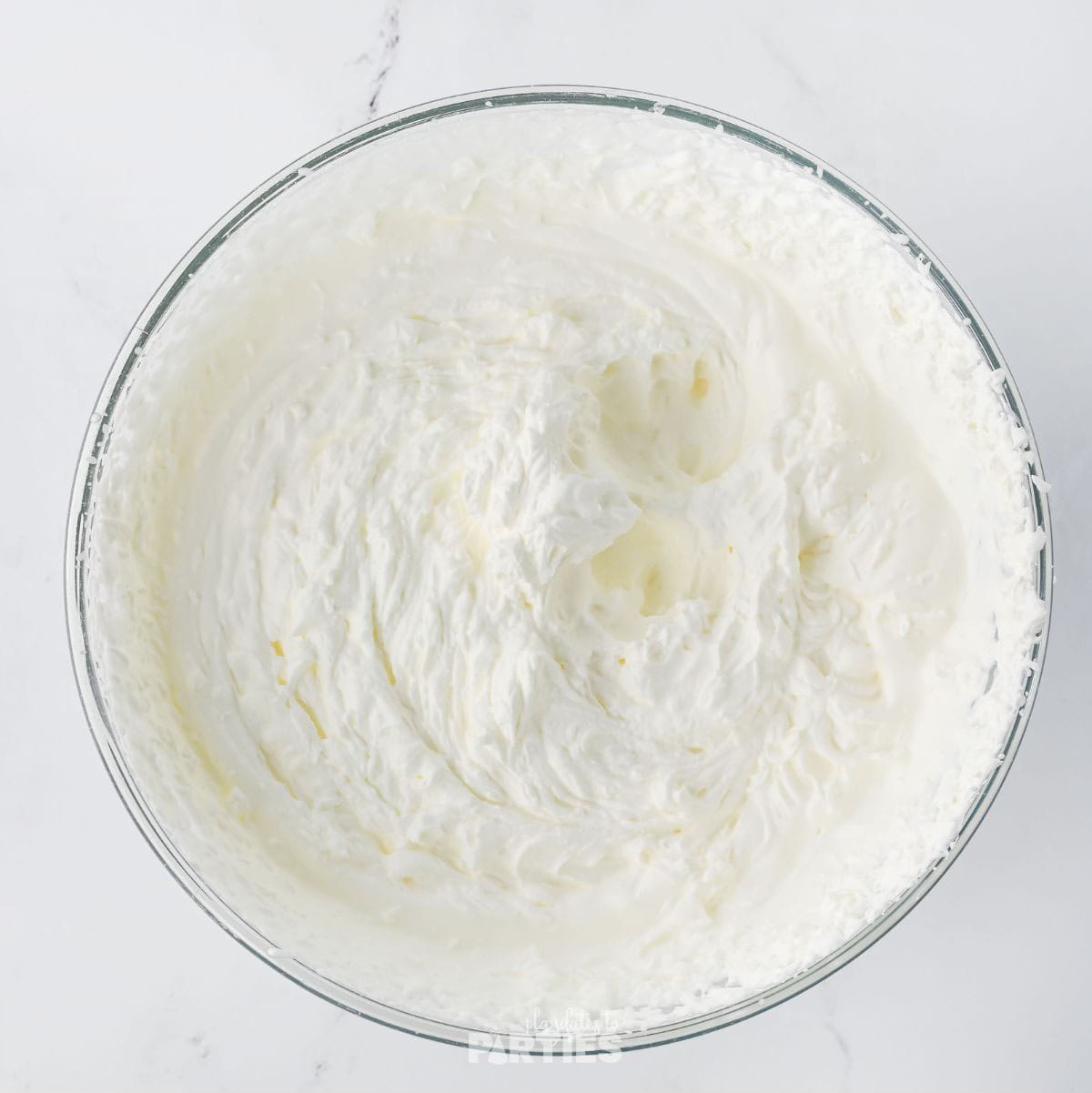 Fresh homemade whipped cream in a bowl.