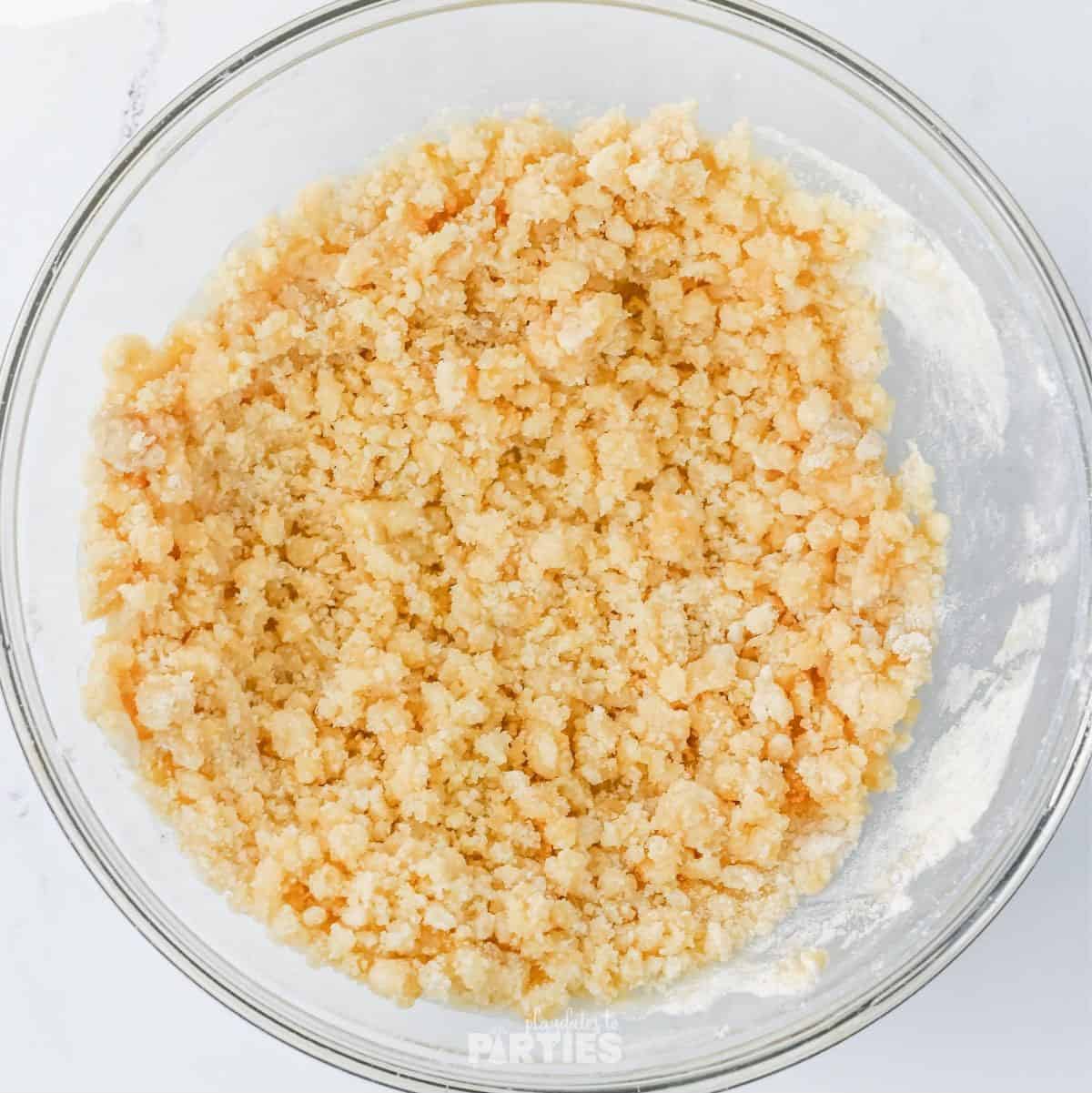 Flour, sugars, and melted butter mixed to create a crumb topping.