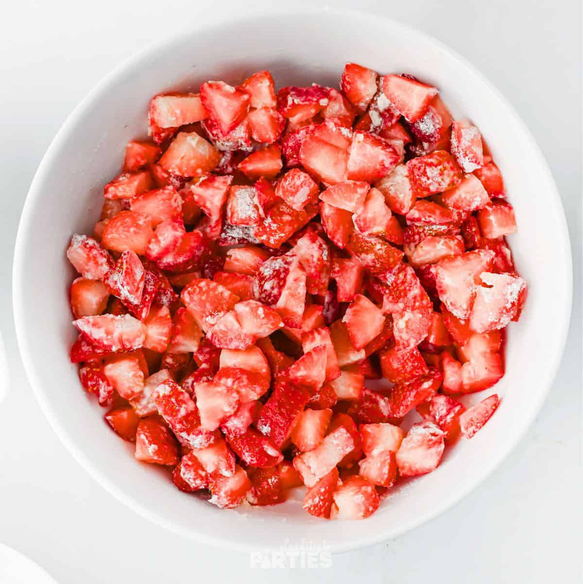 Fresh strawberries mixed with lemon juice, flour, and sugar.