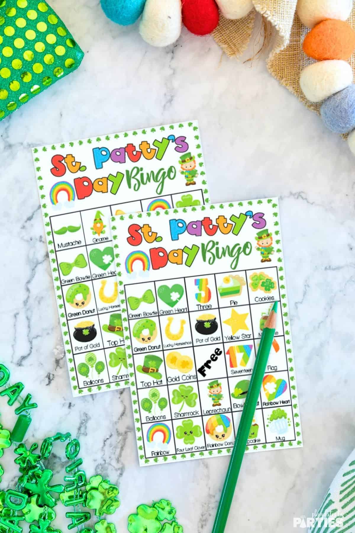 Two St. Patrick's Day bingo cards on a table.