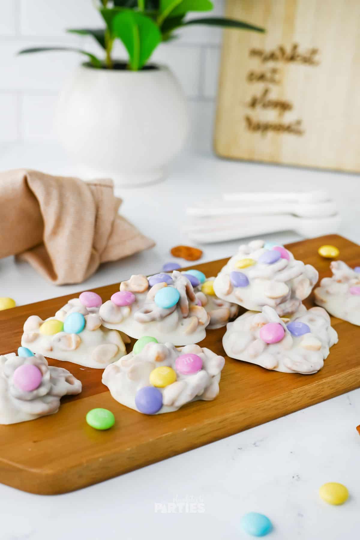 Chocolate coated candy is on a board, ready to be enjoyed.