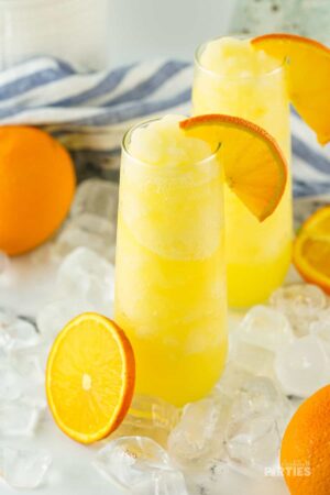Two frozen mimosas in stemless champagne flutes.