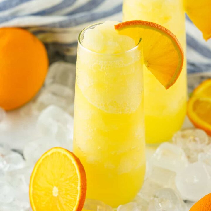 Two frozen mimosas in stemless champagne flutes.