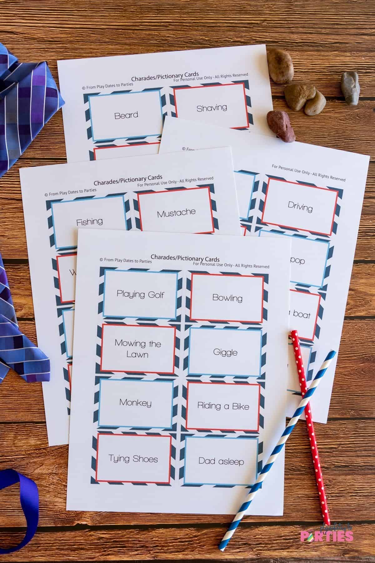 Four pages of pre-filled charades cards with a blue and red motif.