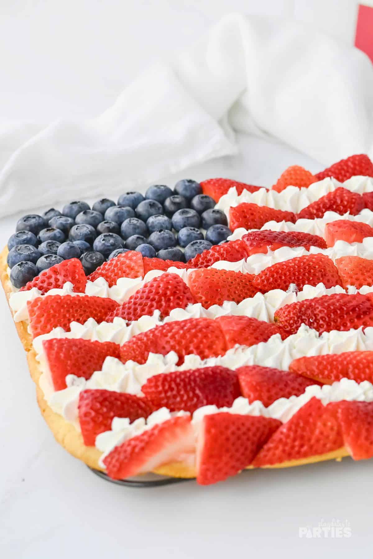From the front you can see the piped whipped cream stars between the rows of strawberries.